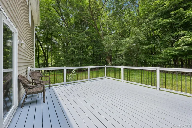 a view of balcony with deck and wooden floor