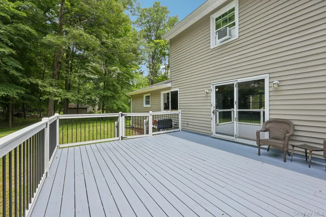 a view of a deck with wooden floor and seating space