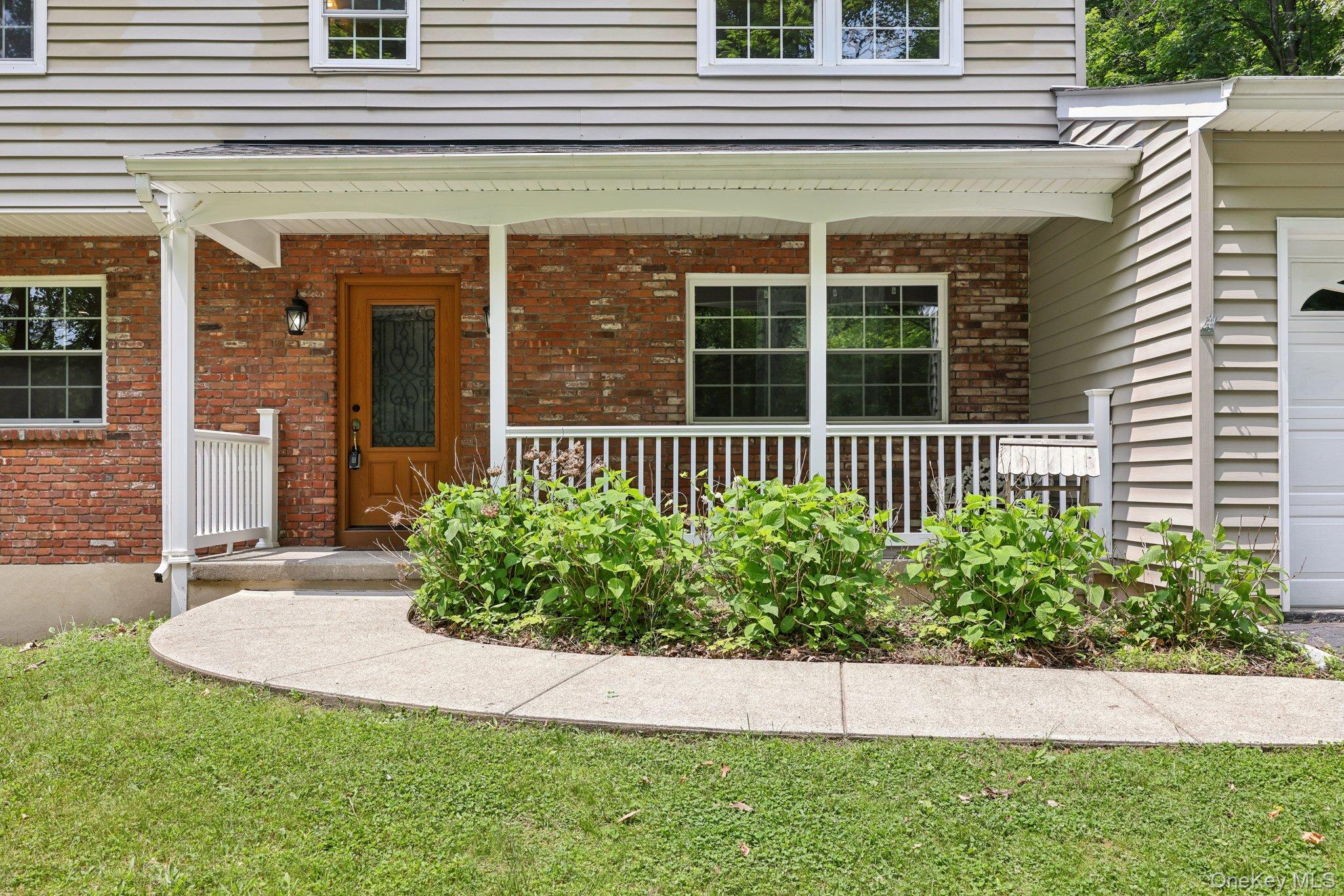 78 Pickerel Road Monroe, NY 10950 - Photo 3 of 37 a front view of a house with a garden
