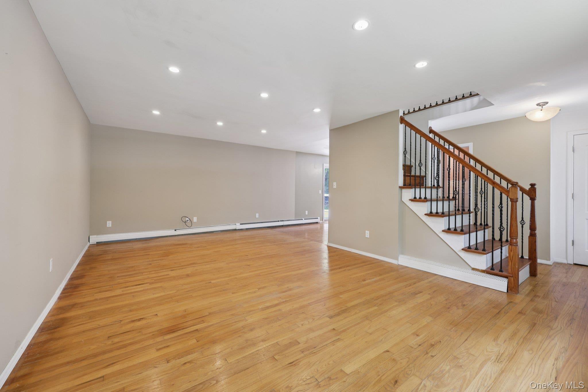 78 Pickerel Road Monroe, NY 10950 - Photo 7 of 37 an empty room with wooden floor and windows