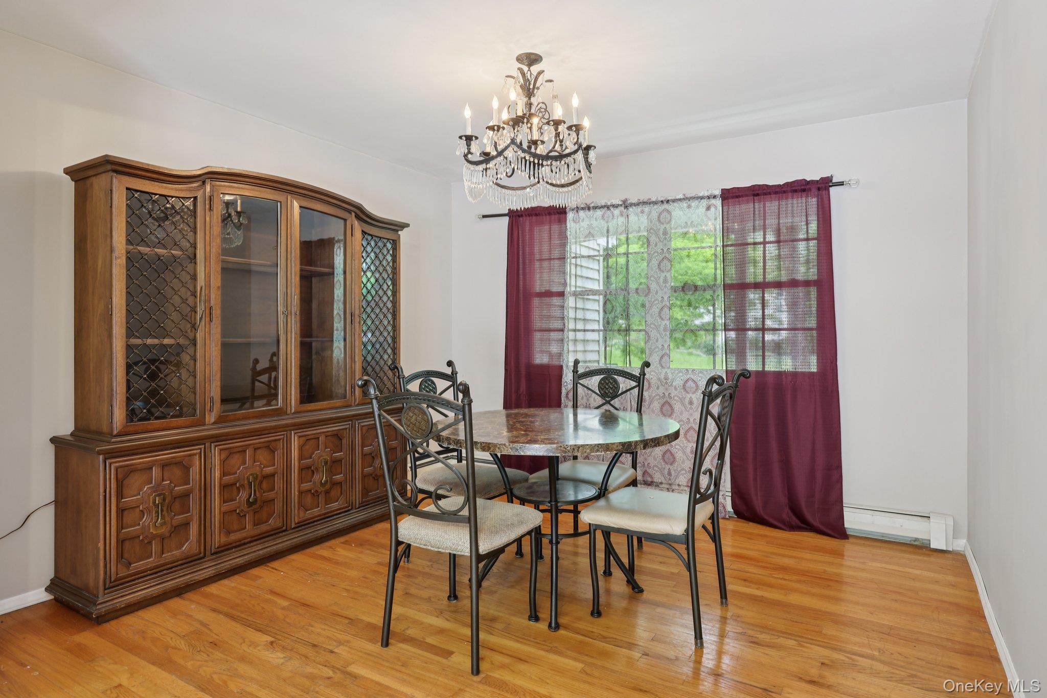 78 Pickerel Road Monroe, NY 10950 - Photo 10 of 37 a view of a dining room with furniture window and wooden floor