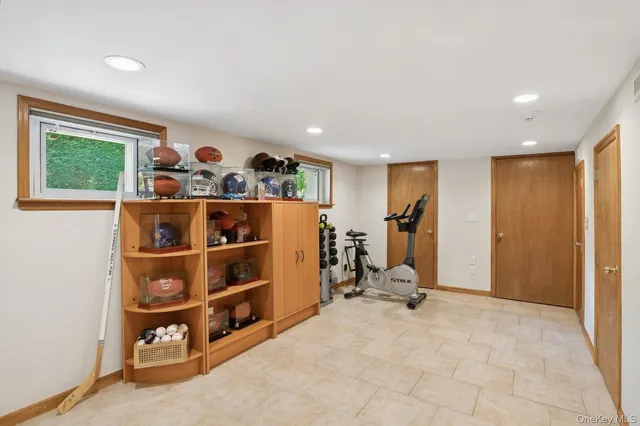 a view of a livingroom with furniture and a window