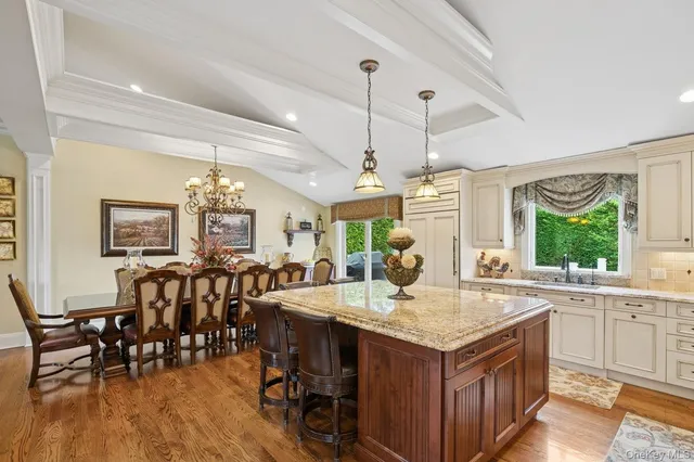 a view of a kitchen counter space dining table and wooden floor