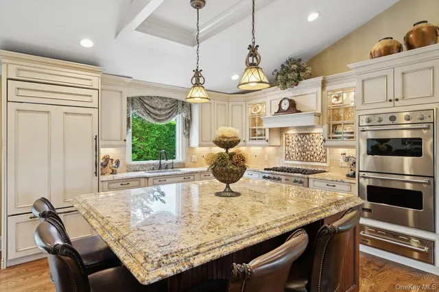 a kitchen with a table chairs and microwave