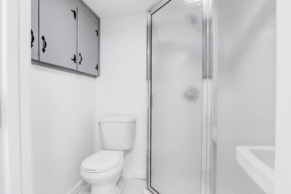 1 Gerrish Road Salisbury, MA 01952 - Photo 8 of 19 a white toilet sitting next to a shower