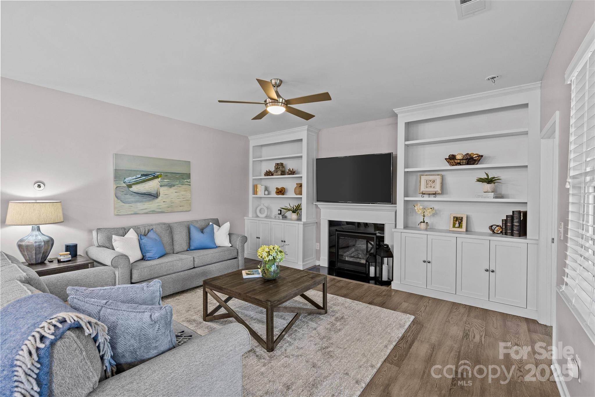 5049 Redwood Grv Trail Lancaster, SC 29720 - Photo 16 of 43 a living room with furniture a fireplace and a flat screen tv