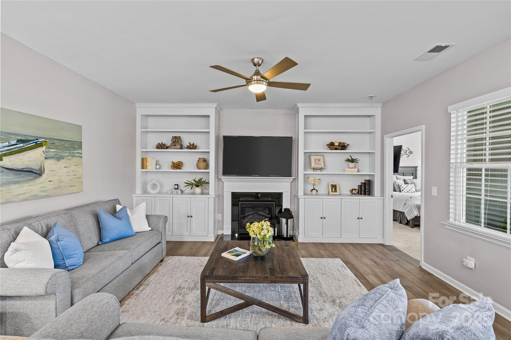5049 Redwood Grv Trail Lancaster, SC 29720 - Photo 18 of 43 a living room with furniture a fireplace and a flat screen tv