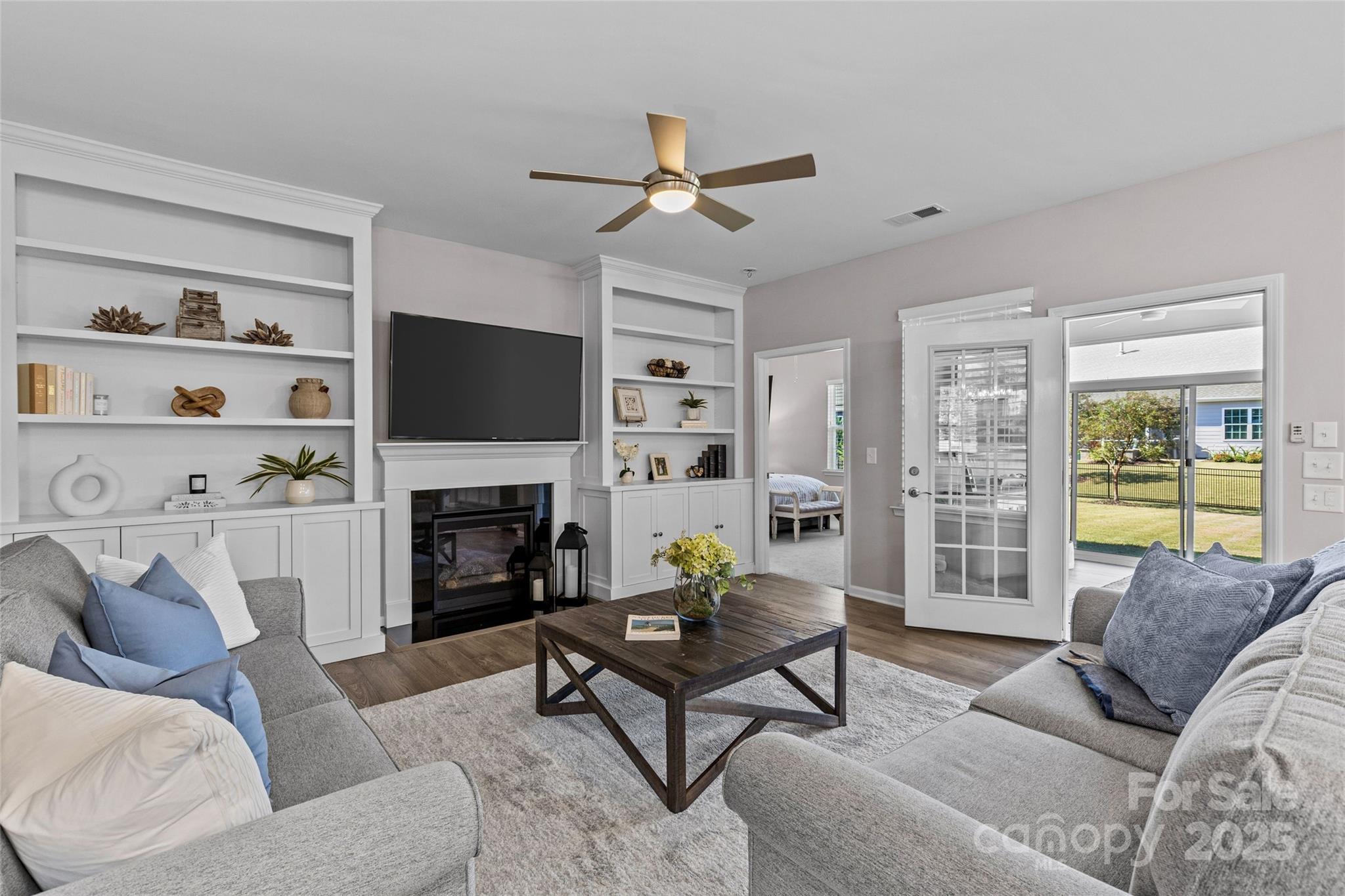 5049 Redwood Grv Trail Lancaster, SC 29720 - Photo 20 of 43 a living room with furniture a flat screen tv and a fireplace