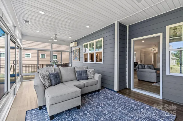 a living room with furniture and a gate