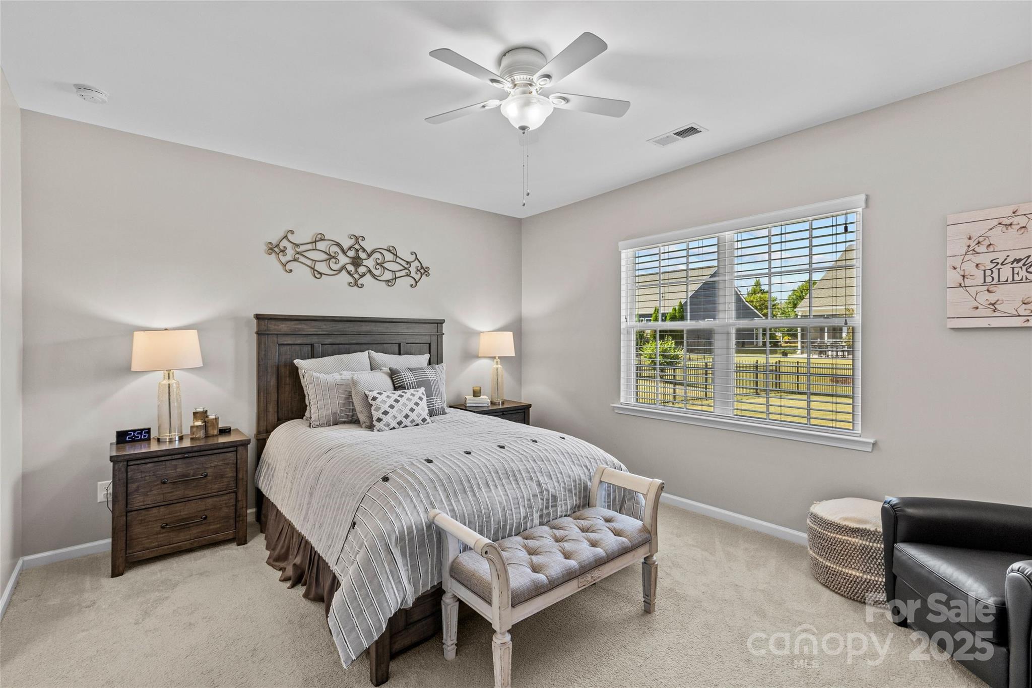 5049 Redwood Grv Trail Lancaster, SC 29720 - Photo 25 of 43 a bedroom with a bed and a chandelier