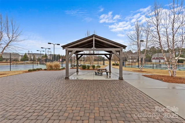 a patio with table and chairs
