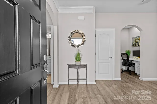 a view of kitchen with furniture and wooden floor