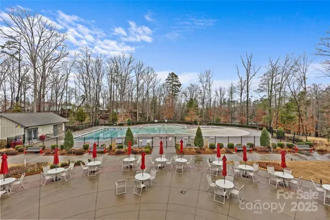 a group of people sitting around a yard