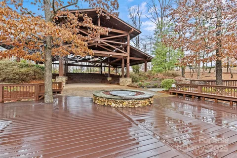 a view of a swimming pool with seating space