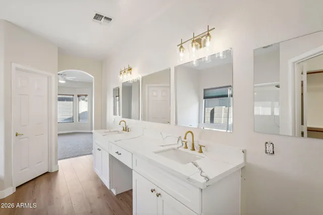 a kitchen with a sink stove and microwave