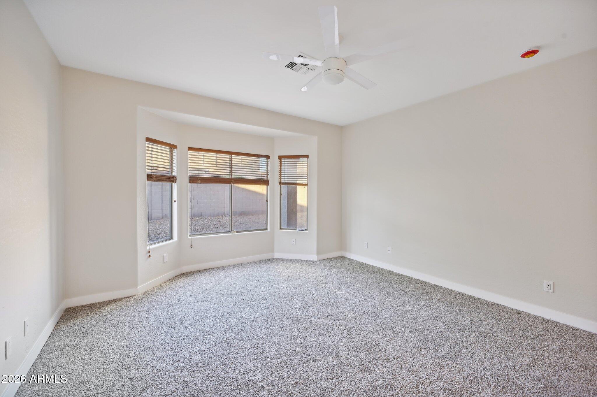12806 West Charter Oak Road El Mirage, AZ 85335 - Photo 22 of 36 a view of an empty room with a window