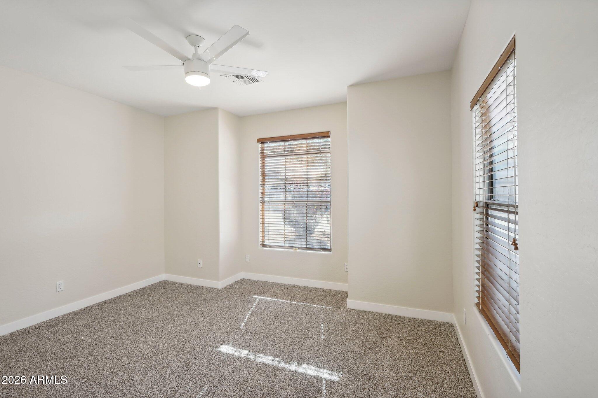 12806 West Charter Oak Road El Mirage, AZ 85335 - Photo 29 of 36 a view of an empty room with a window