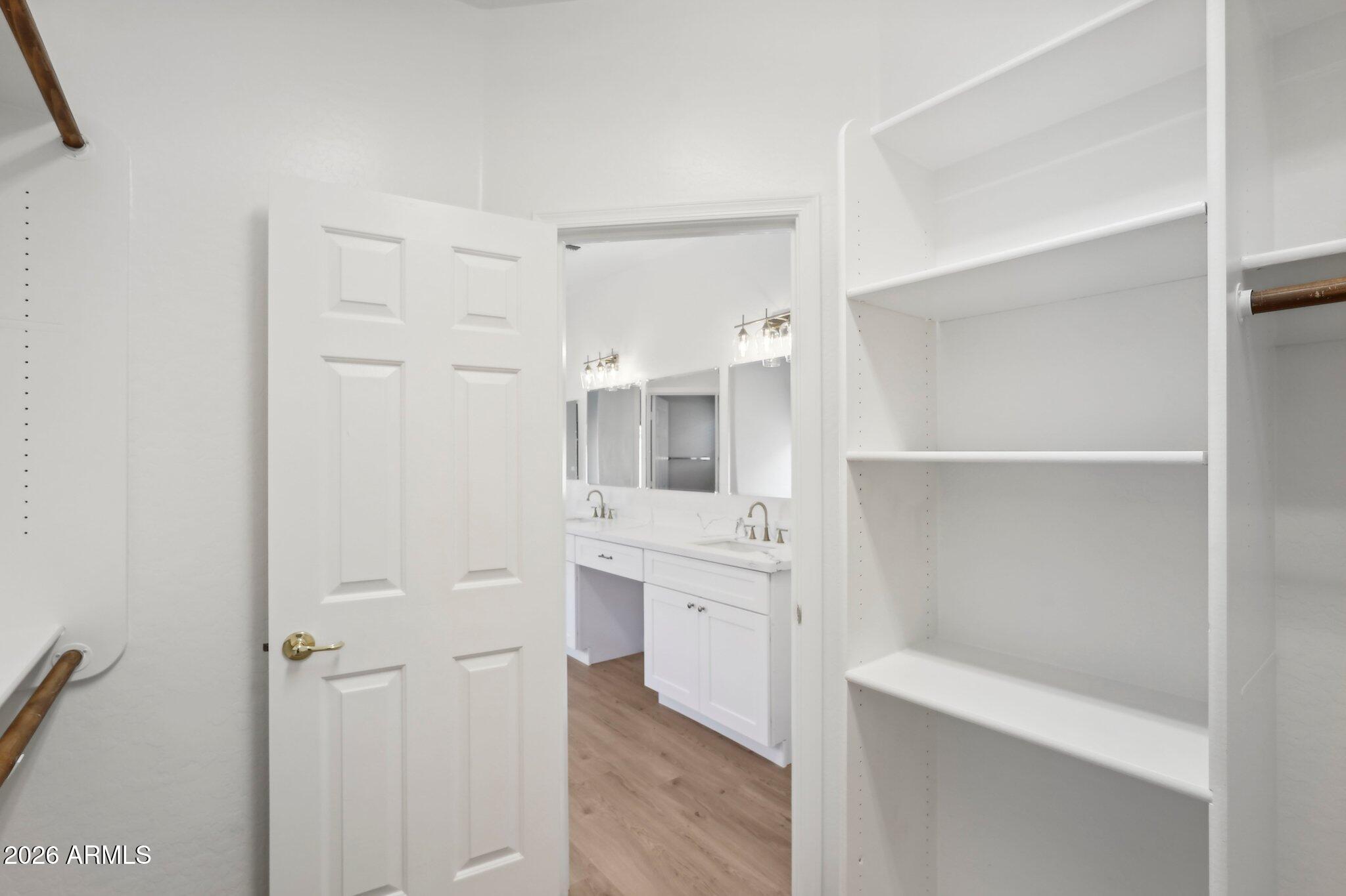 12806 West Charter Oak Road El Mirage, AZ 85335 - Photo 35 of 36 a bathroom with a sink a toilet and shower