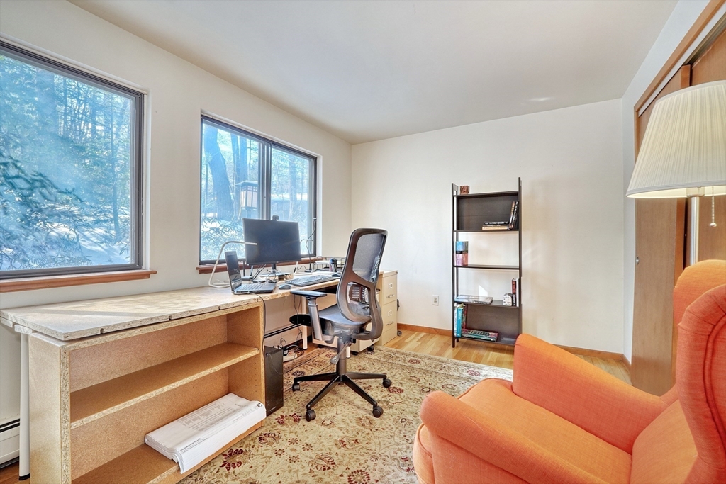 23 Wolf Pine Way Concord, MA 01742 - Photo 7 of 39 a view of a workspace with furniture and a window