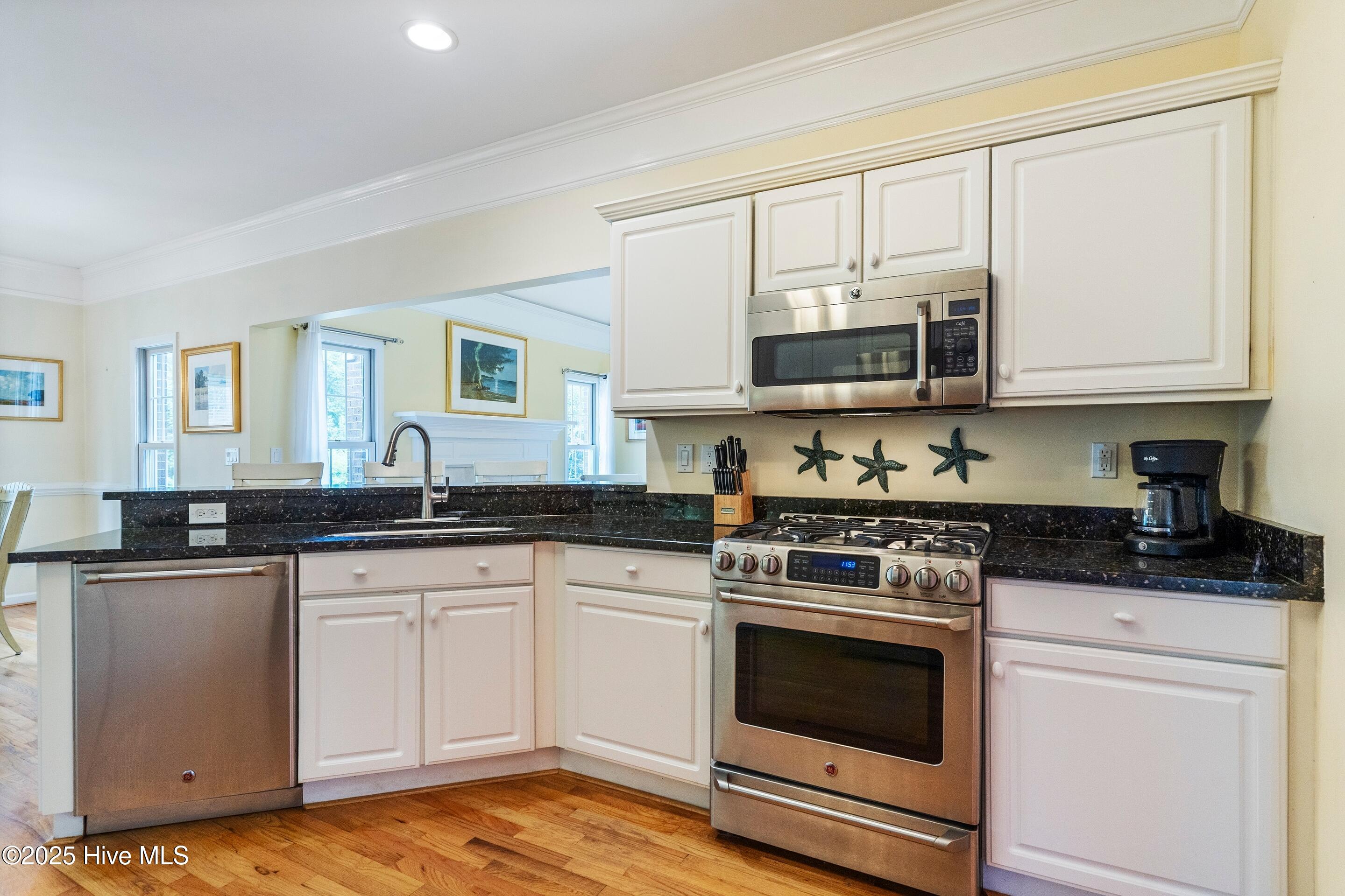 1020 Cordgrass Road Hampstead, NC 28443 - Photo 12 of 65 Electric range and built in microwave, granite countertops