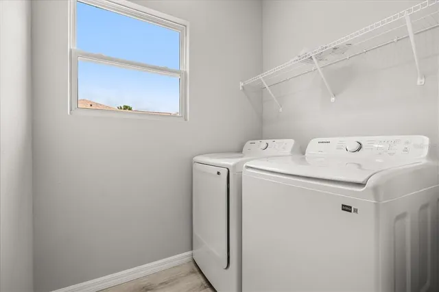 a utility room with dryer and washer