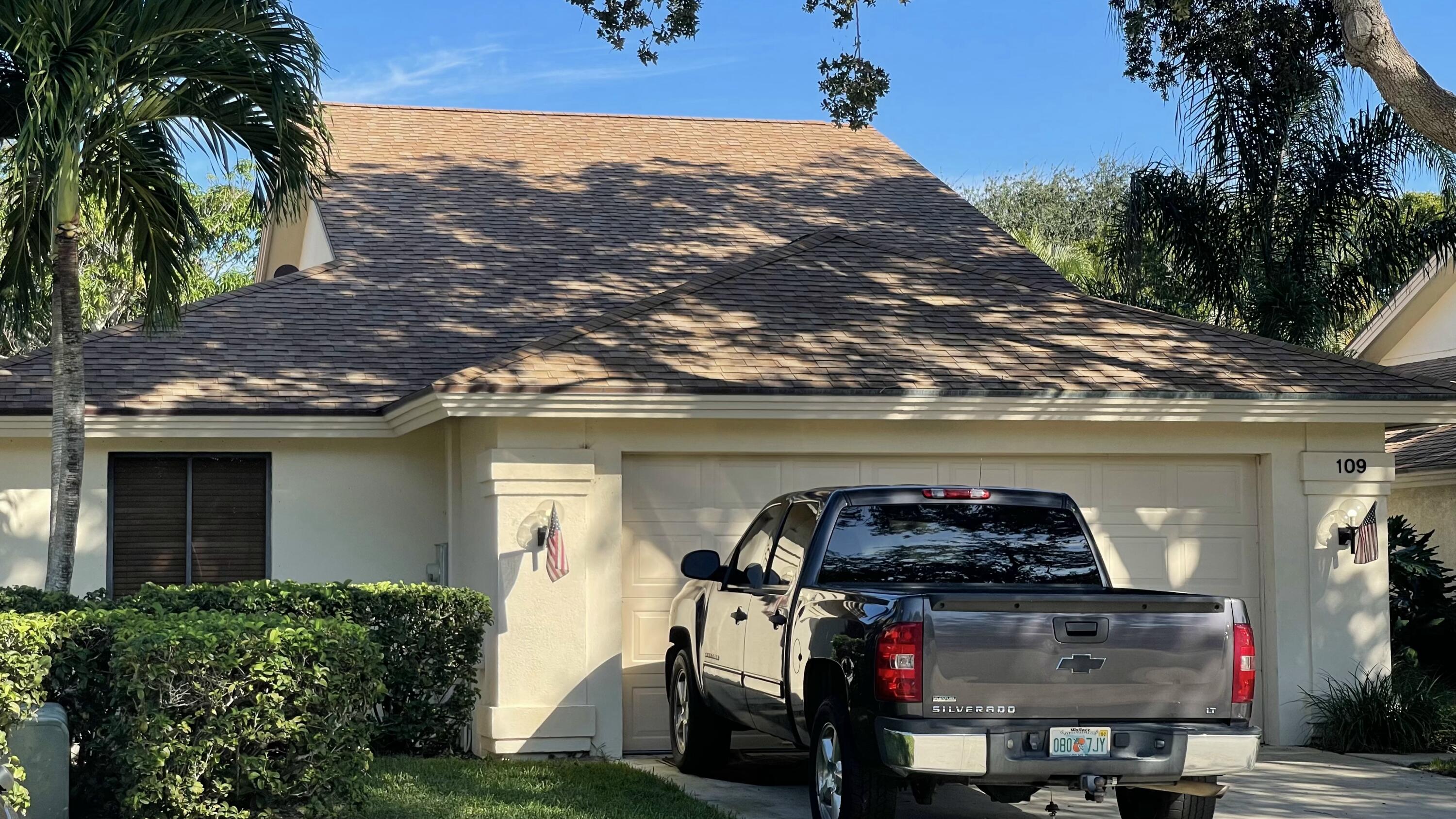 109 Harbourside Circle Jupiter, FL 33477 - Photo 1 of 4 a front view of a house with balcony