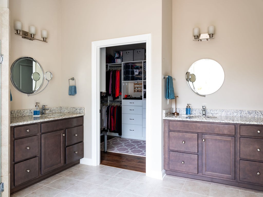 8012 Rose Rdg Lane Fairview, TN 37062 - Photo 17 of 52 a spacious bathroom with a granite countertop sink and a mirror