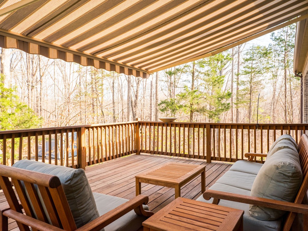 8012 Rose Rdg Lane Fairview, TN 37062 - Photo 42 of 52 a balcony with wooden floor table and chairs