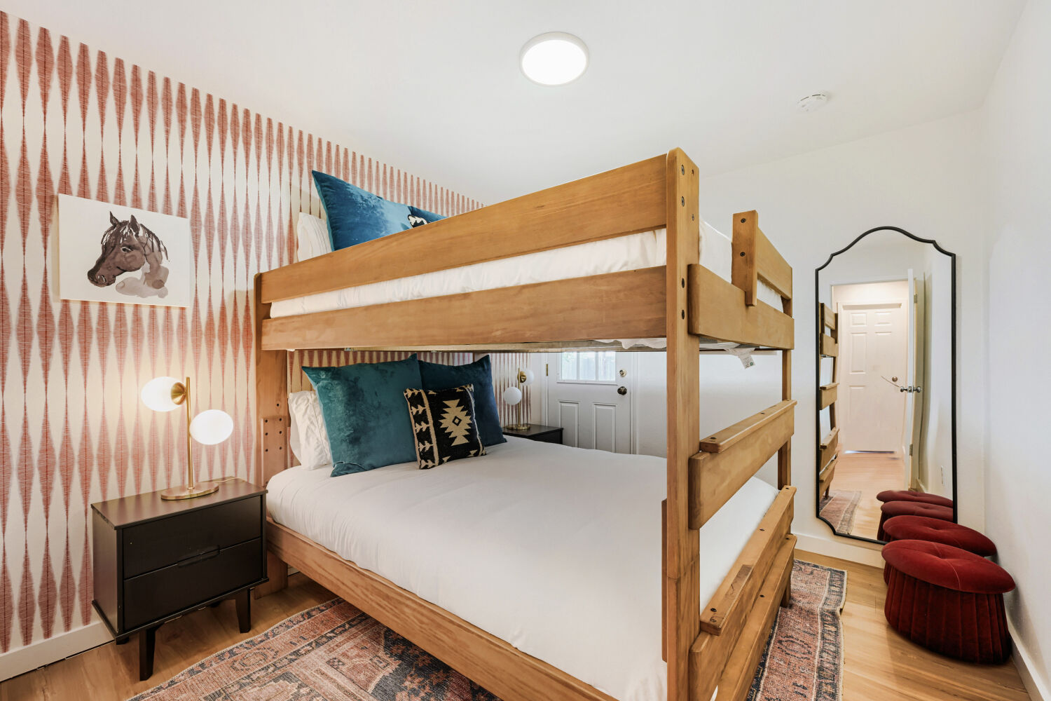 3410 Plantation Road Austin, TX 78745 - Photo 26 of 33 An inviting sleeping space with wooden bunk beds and hardwood flooring offers comfortable accommodation.