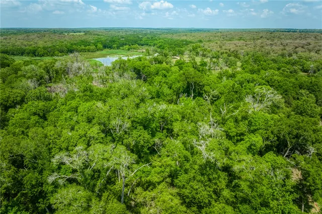 a view of a big yard with a house
