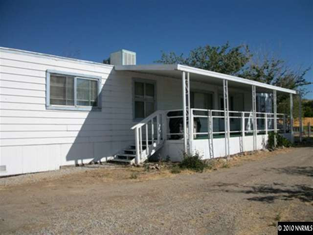 16125 Rhyolite Circle Reno, NV 89521 - Photo 2 of 8 a view of a house with a yard