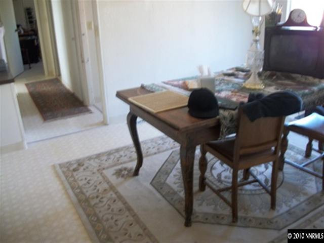 16125 Rhyolite Circle Reno, NV 89521 - Photo 3 of 8 a view of a workspace room with furniture and rug
