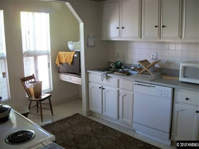 16125 Rhyolite Circle Reno, NV 89521 - Photo 6 of 8 a kitchen with sink cabinets and appliances