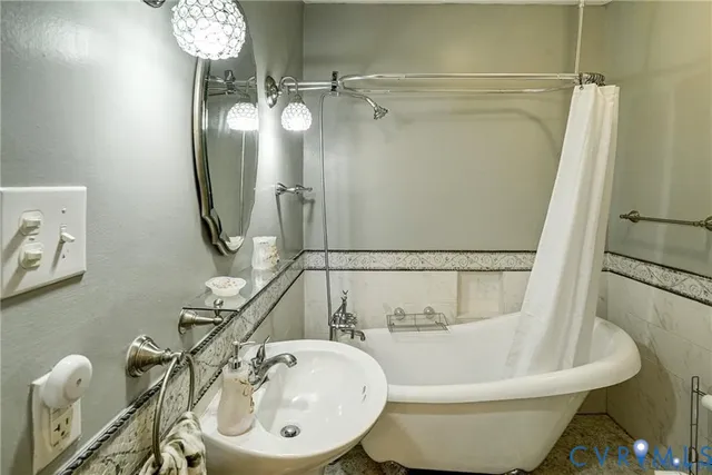 a bathroom with a sink and mirror