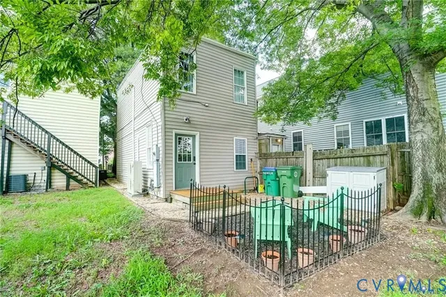 a view of a house with a yard and a garden