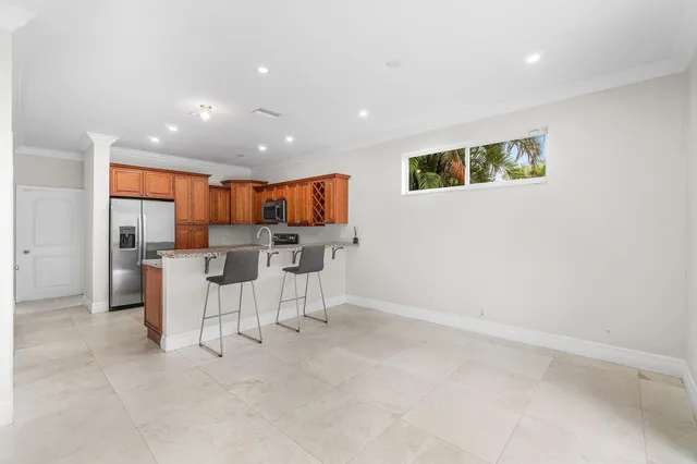 a view of kitchen with furniture and wooden floor