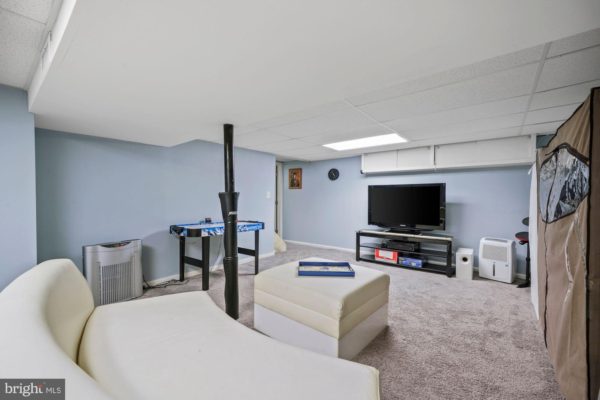 3 Albemarle Road Hamilton, NJ 08690 - Photo 13 of 27 a living room with furniture and a flat screen tv