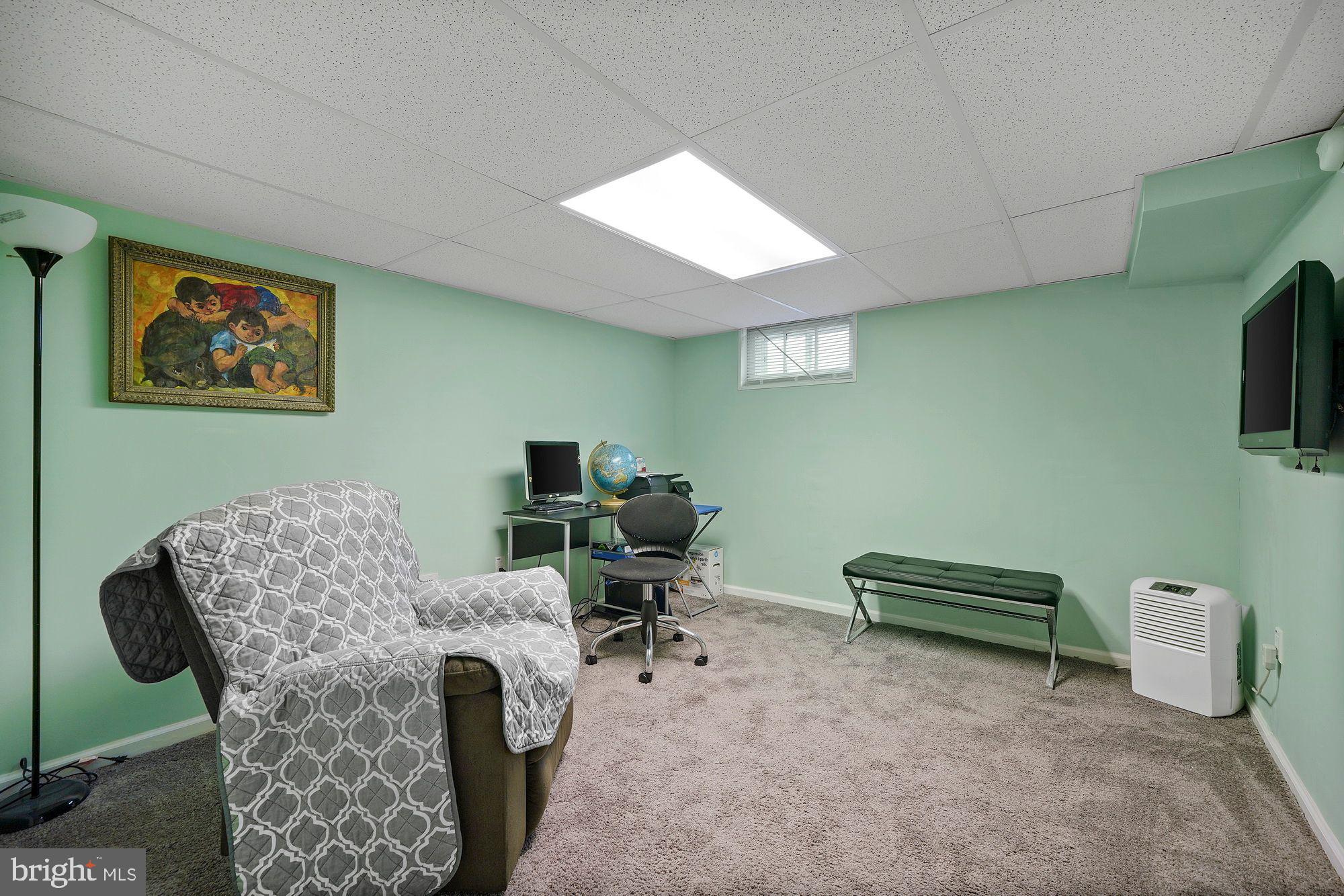 3 Albemarle Road Hamilton, NJ 08690 - Photo 15 of 27 a work room with furniture and a flat screen tv
