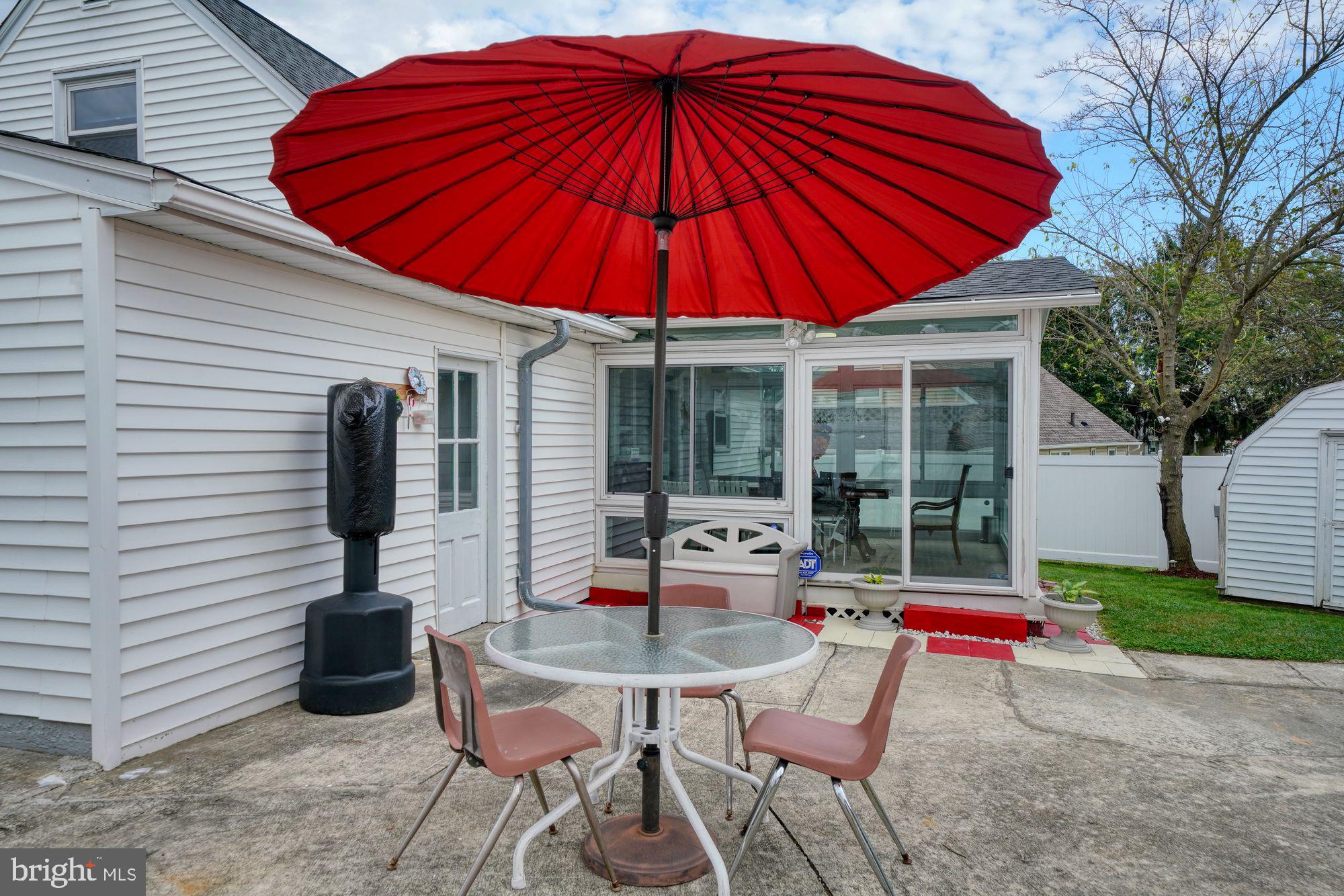 3 Albemarle Road Hamilton, NJ 08690 - Photo 17 of 27 a blue and white umbrella sitting in front of a house