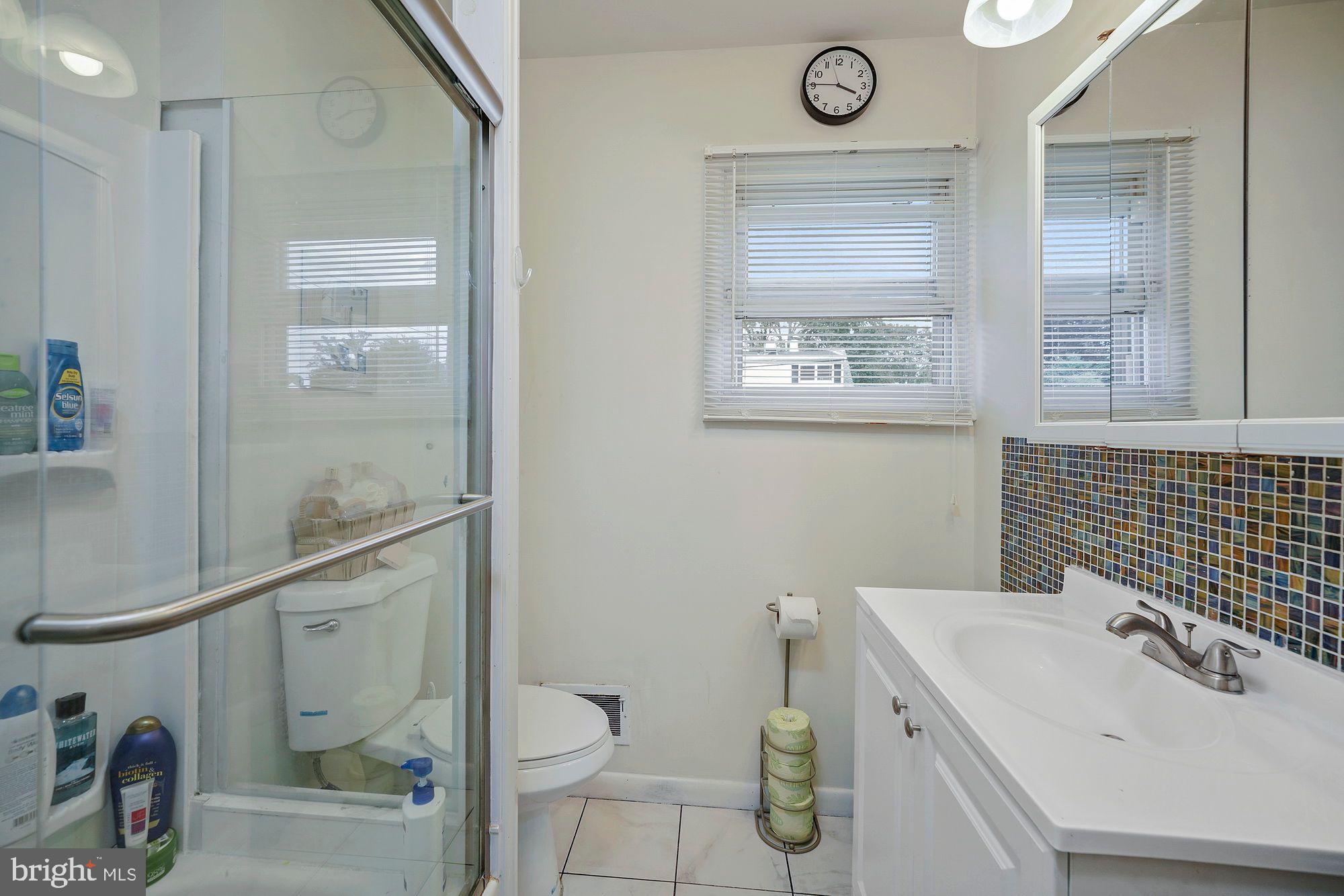 3 Albemarle Road Hamilton, NJ 08690 - Photo 19 of 27 a bathroom with a toilet a sink and mirror
