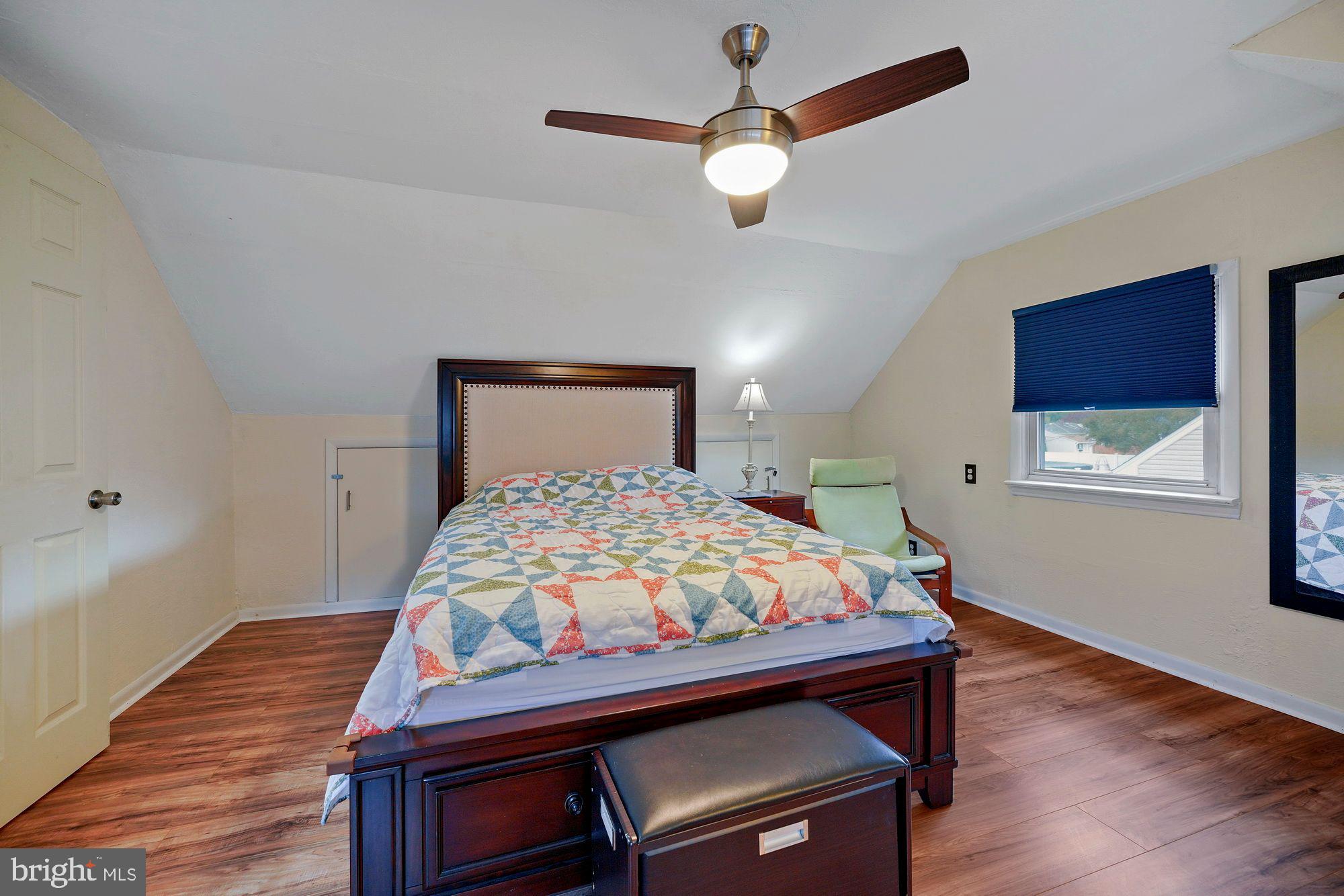 3 Albemarle Road Hamilton, NJ 08690 - Photo 23 of 27 a bedroom with a bed and a chandelier