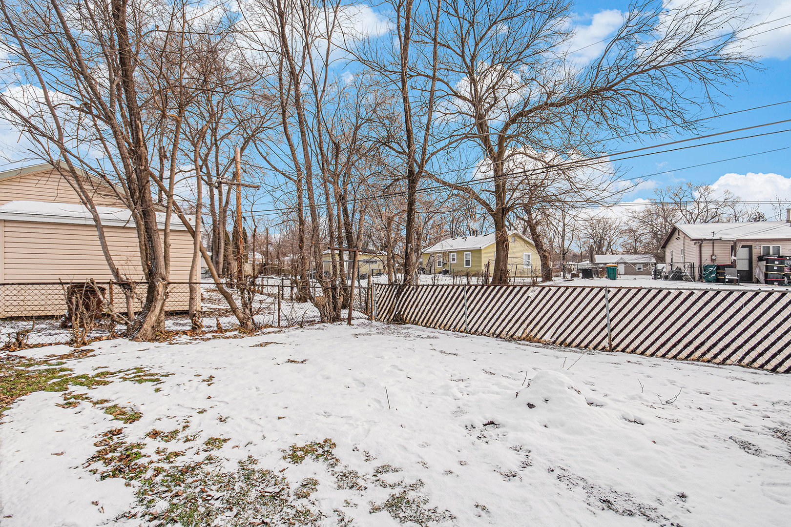 512 Sehring Street Joliet, IL 60436 - Photo 15 of 15 a view of a yard covered in snow