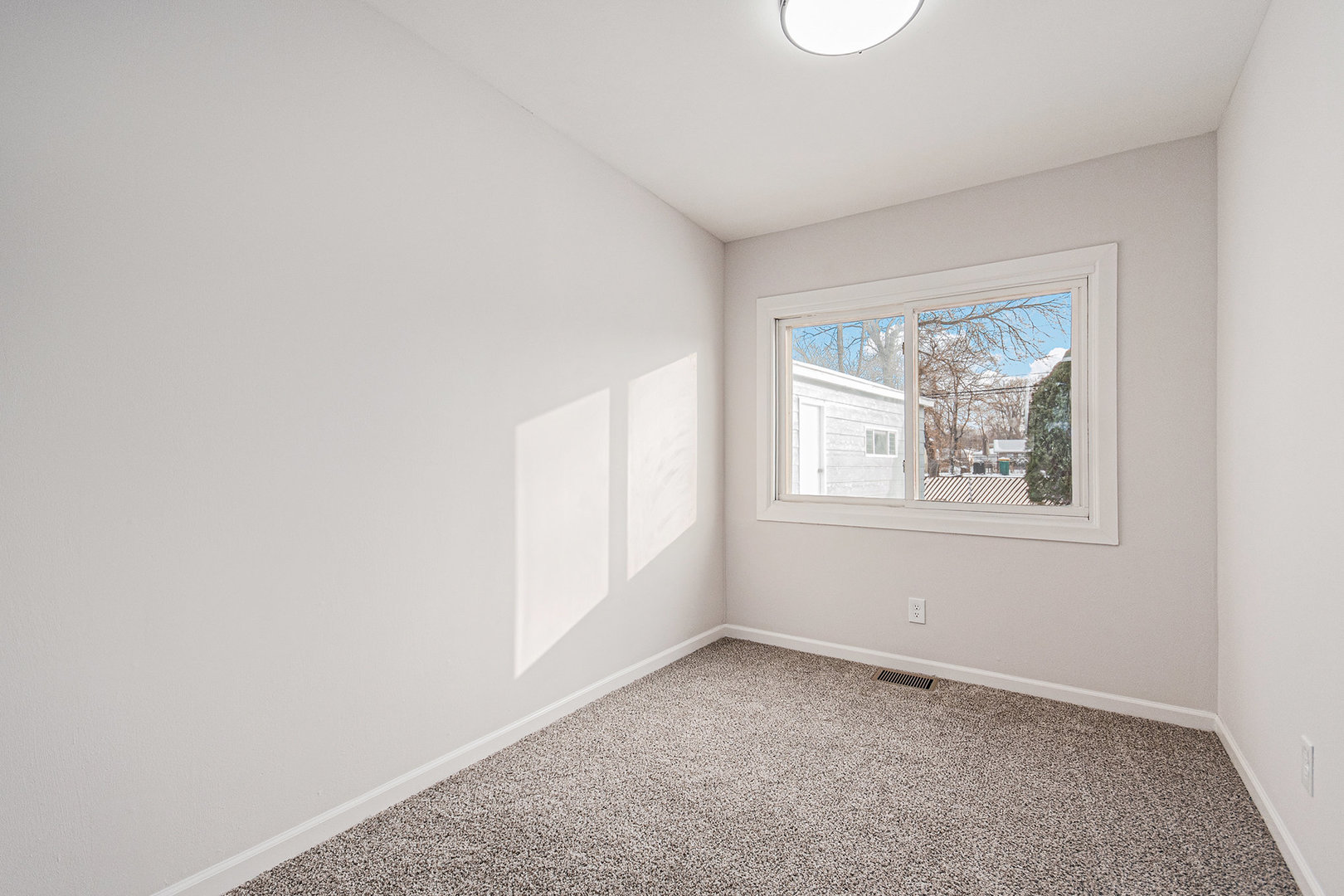 512 Sehring Street Joliet, IL 60436 - Photo 7 of 15 an empty room with a window