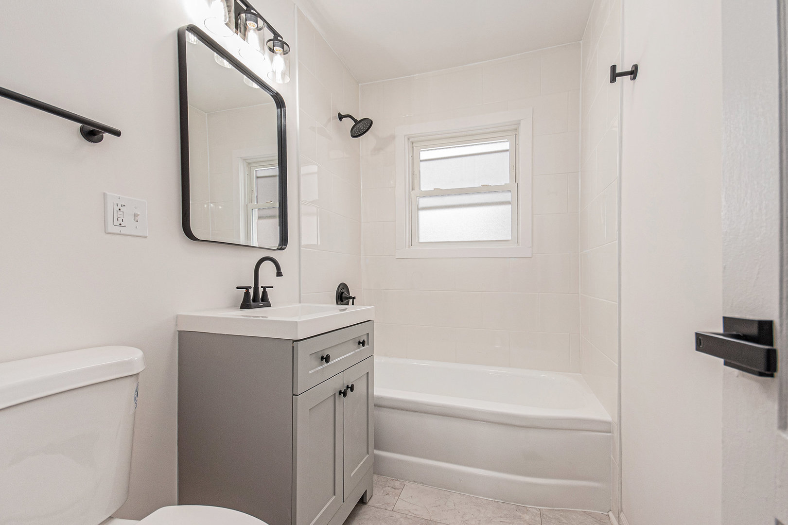 512 Sehring Street Joliet, IL 60436 - Photo 10 of 15 a bathroom with a sink a toilet and a mirror