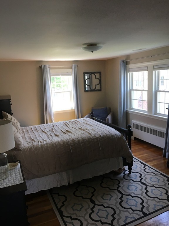 4 Latin Road Boston, MA 02132 - Photo 14 of 16 a bedroom with a bed and a window