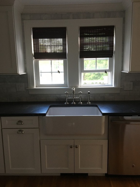 4 Latin Road Boston, MA 02132 - Photo 4 of 16 a view of a kitchen with a sink and window