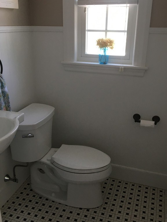 4 Latin Road Boston, MA 02132 - Photo 9 of 16 a bathroom with a toilet and a window