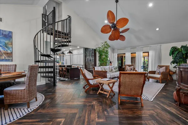 a view of a dining room with furniture wooden floor and chandelier