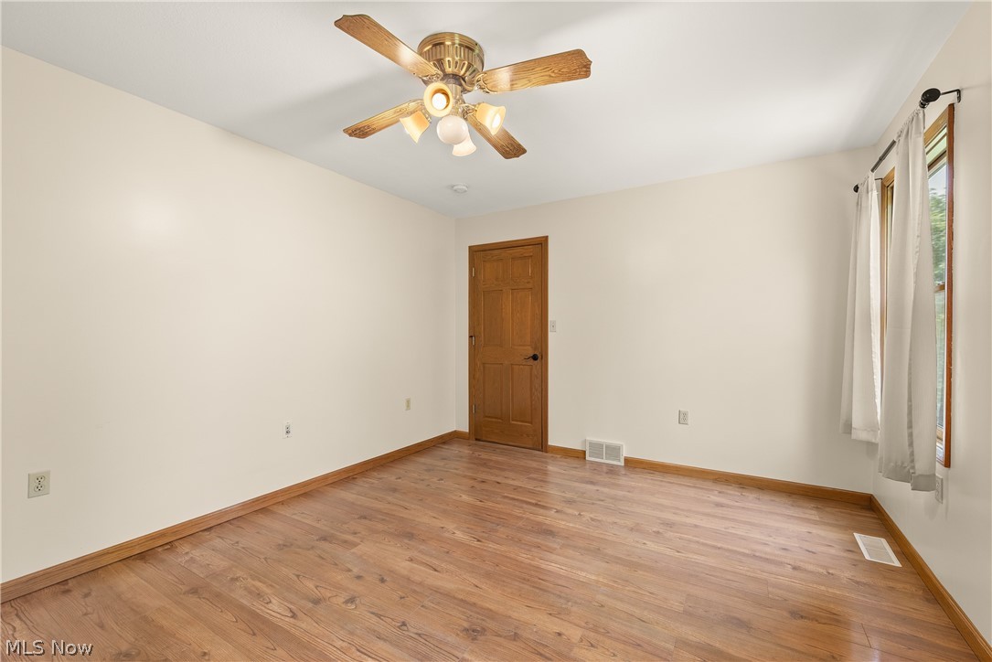 9990 Broadview Road Broadview Heights, OH 44147 - Photo 34 of 47 Unfurnished room featuring light wood-style flooring and ceiling fan