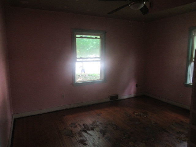 211 South Lafayette Street Byron, IL 61010 - Photo 11 of 26 an empty room with a window